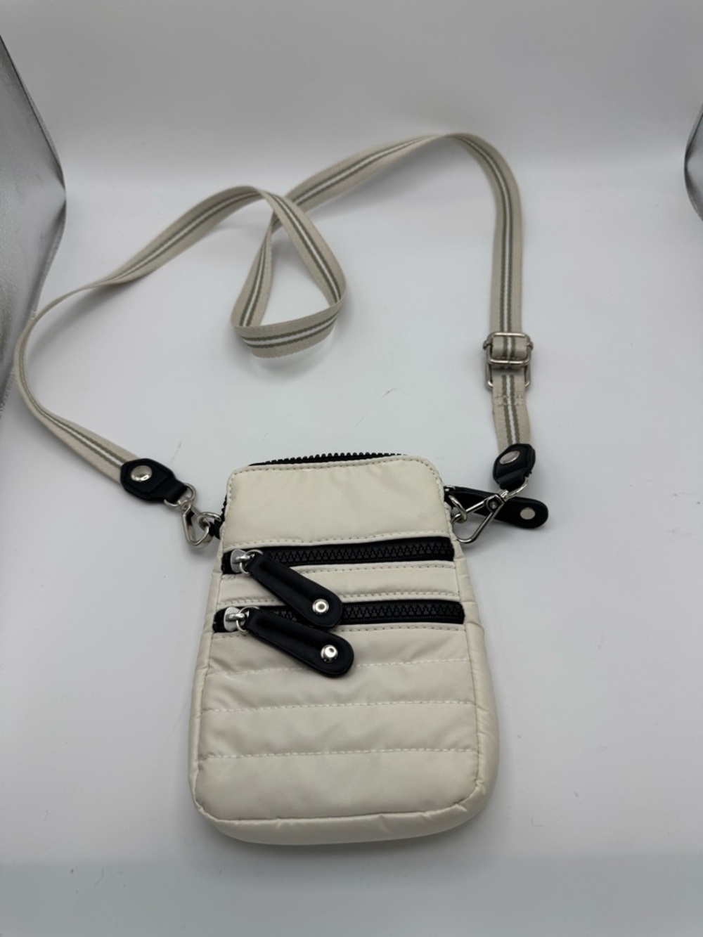 Sondra Roberts Cream Crossbody Phone Bag with Black Zipper Accents
